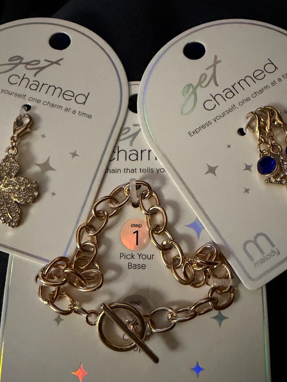 Create your own Gold tone Link Charm Bracelet with 4 charms included.
